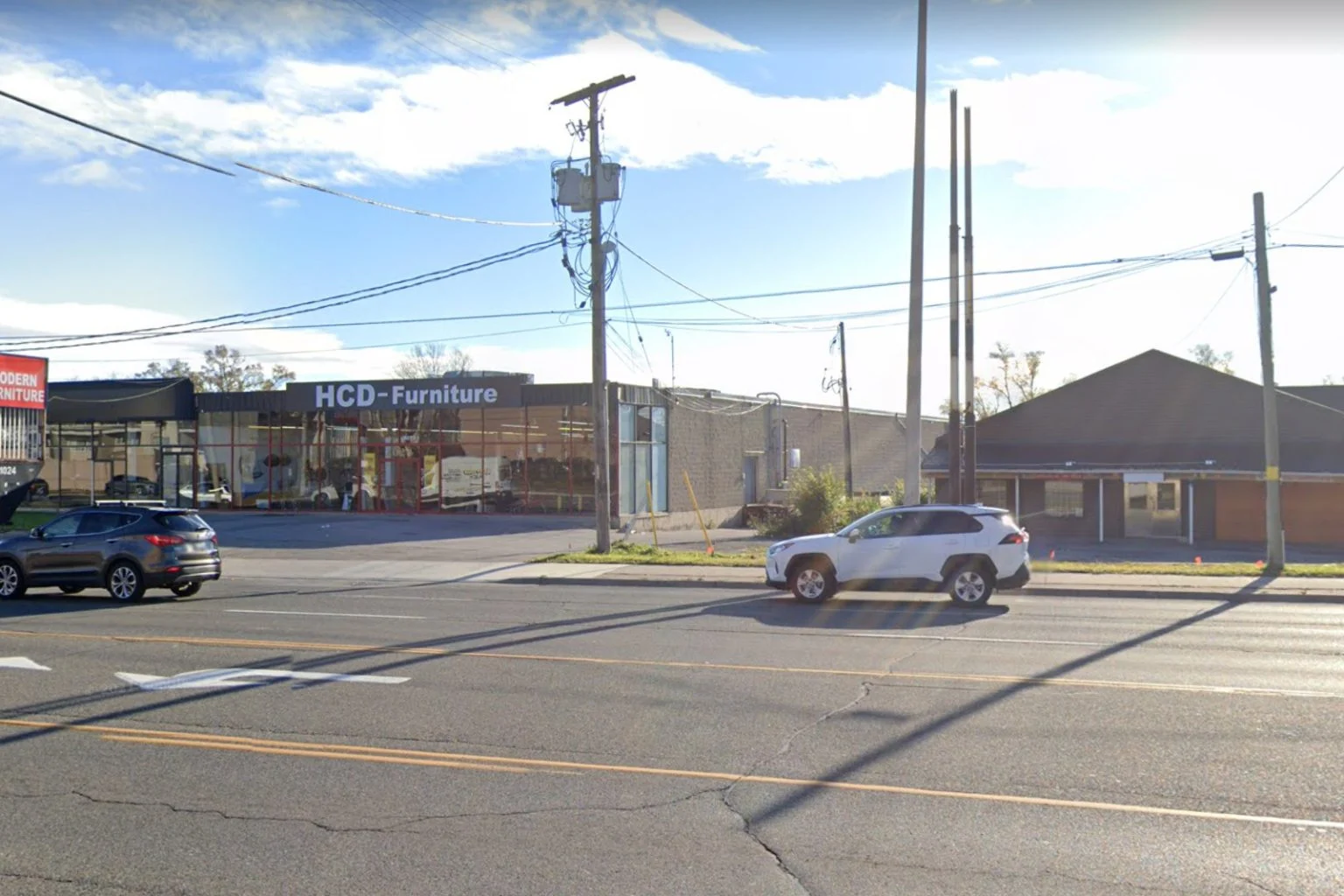 HCD Furniture store on a busy street, site for new rental complex.